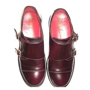 Wine colored double strap shoes.